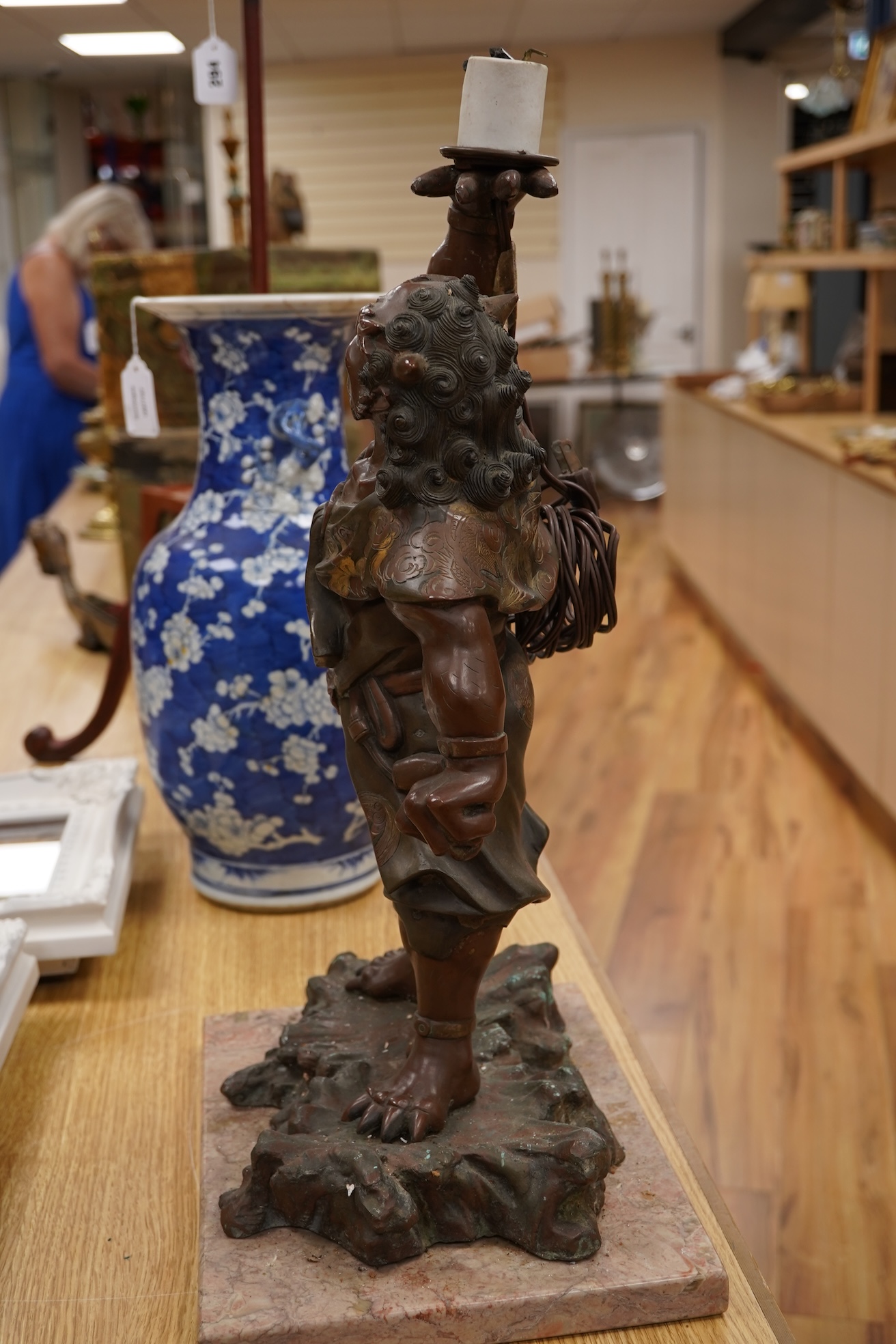 A Japanese bronze model of an oni, Meiji period, now mounted as a lamp, 50cm
